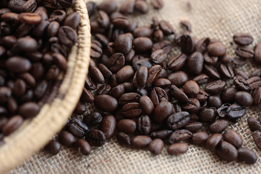 Coffee beans served in a hand-woven colander