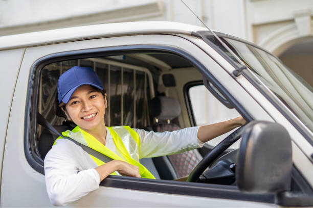 istock Female van driver preparing to leave on road trip 1999293921