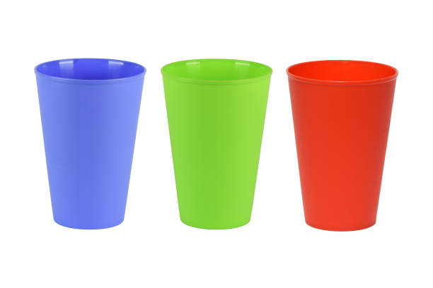 istock A set of plastic colored glasses. Tableware for a picnic. Isolate on a white background. 1999338545