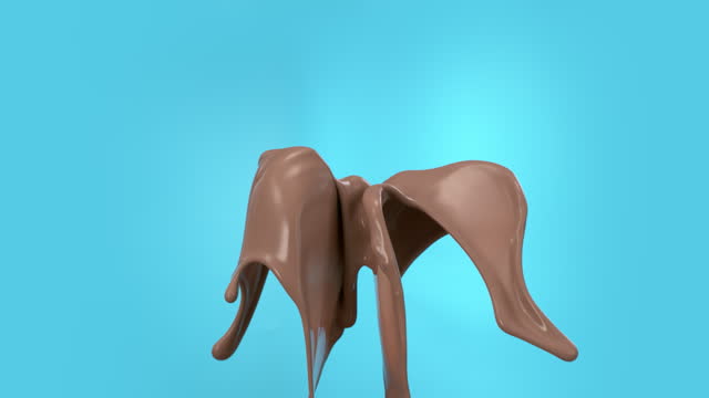 Super slow motion liquid chocolate splash with droplets cut out on blue background
