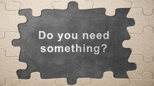 istock Jigsaw puzzle piece with text of 'Do you need something?' 1999404553