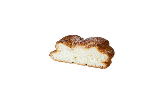 Sweet bun in section on a white background. Plushka bun from Berdyansk bakery Sweet bun in section on a white background. Isolated. Plushka bun from Berdyansk bakery plushka stock pictures, royalty-free photos & images