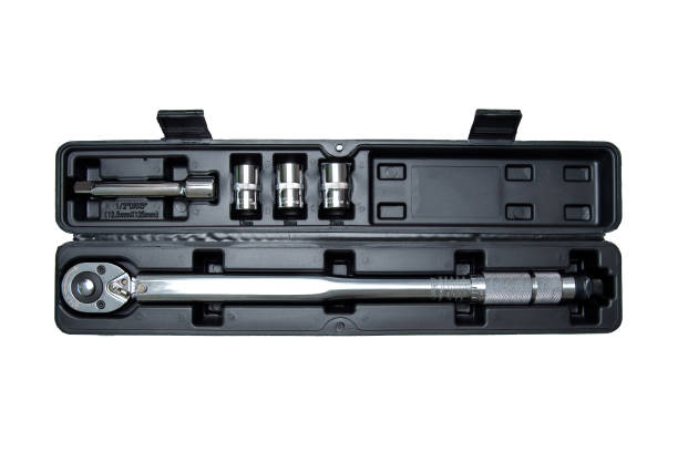 istock torque wrench in a case on a white background. Adjustable torque wrench spanner hand tool and different nuts. 1999489368