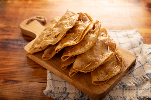 Pescadillas. So called when they are stuffed with fish such as tuna, popular during the Lent season. They are known as Golden Quesadillas when they are filled with ingredients such as meat or potatoes