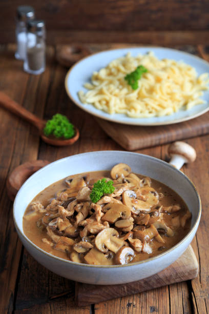 istock Sliced meat with mushrooms and spaetzle 1999517532