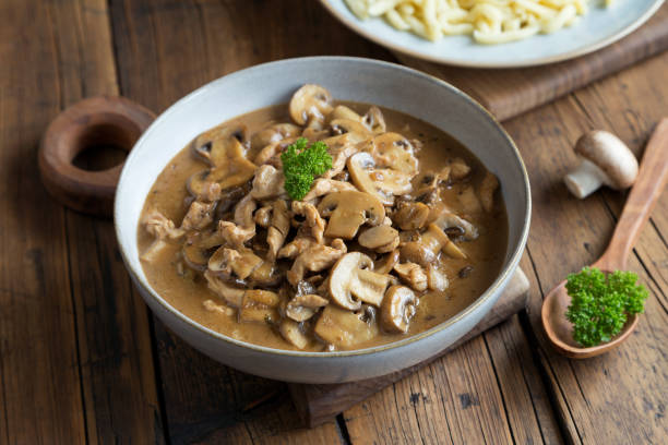 istock Sliced meat with mushrooms and spaetzle 1999517534