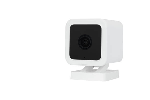 istock Angled View of White Cube Shaped Smart Home Camera / Webcam on Swivel Stand - Isolated on White Background 1999537283