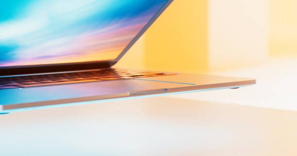 The metallic silver laptop's sleek design and high-resolution display make it a stylish and powerful tool for productivity and entertainment, with the screen slightly open, inviting you to start exploring.