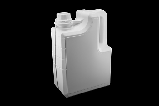 New white plastic oil canister isolated on black background.  Storage tank. Canister for gasoline, diesel and gas. White plastic canister for technical liquids isolated.
