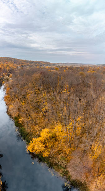 istock Autumn aerial river scenery with forest riverside 1999600525