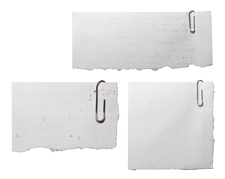 Reused note memo paper with paper clips on white background with clipping path