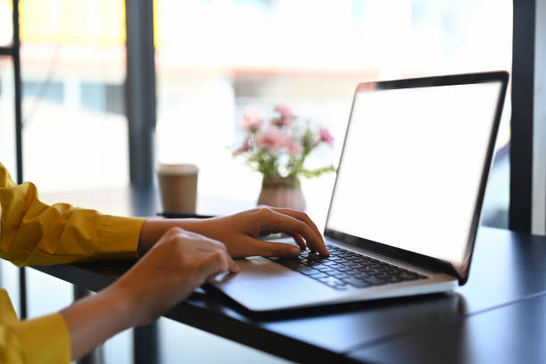istock Woman hands typing on laptop keyboard, checking email or searching information 1999658775