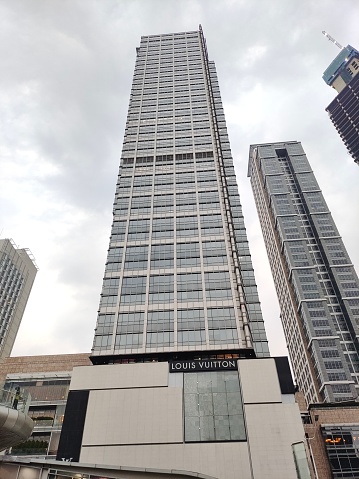 Tall building perspective in a big city low angle shot of modern glass city buildings during sunny day modern building