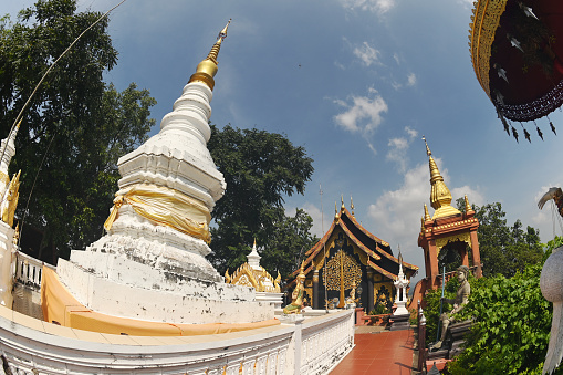 White Pagoda with a golden crown and tiers. It is a relic that has existed since the beginning on top of mountain at Wat Pra That Doi Pra Chan.