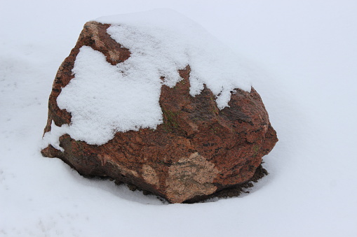 Huge granite stone in the winter garden