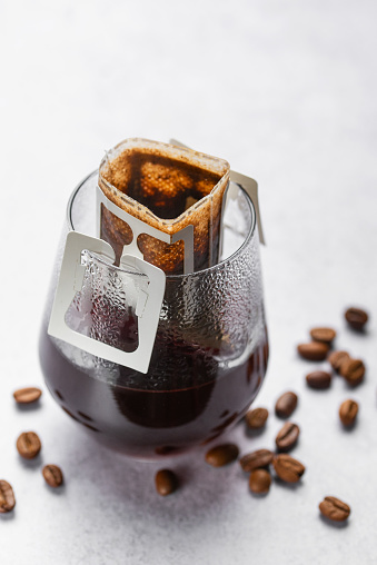 Drip Coffee Bag in a Glass Cup photo