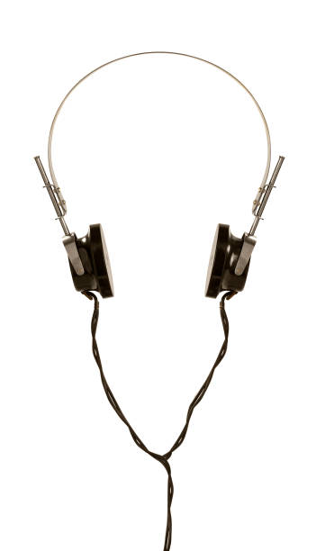 Old fashioned black headphones with black wires on a metal arc. Isolated on white background