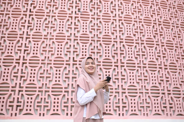 istock Muslim woman using smart phone 1999724902
