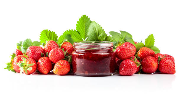 istock Strawberry jam and fresh berries are isolated on a white background. 1999737274