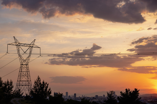 High-voltage power lines at sunset,high voltage electric transmission tower.