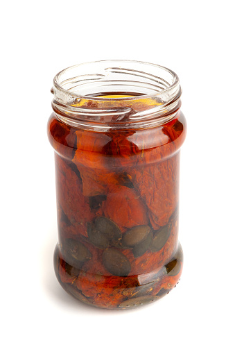 Dry Tomatoes in Jar Isolated, Sun Dried Pomodoro Preserve, Dehydrated Tomato In Olive Oil, Cured Sundried Vegetable Slices, Dry Plum Tomatoes in Glass Jar on White Background