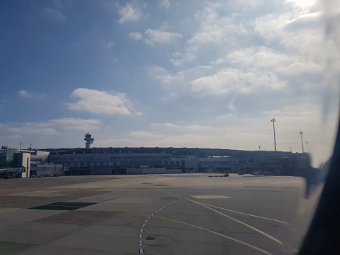 Dusseldorf, Germany - march 24, 2017 - the view of Dusseldorf international airport ramp at day and air traffic control tower ATC is appear