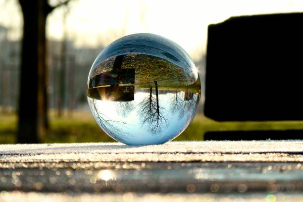 istock Crystal ball on wooden table 1999832500