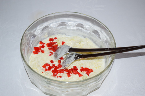 bright red chili pepper sliced on the cream sauce