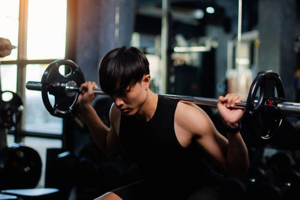 istock Exercise with dumbbells Lift weights to build strong arm muscles, an activity for good physical health. 1999862591