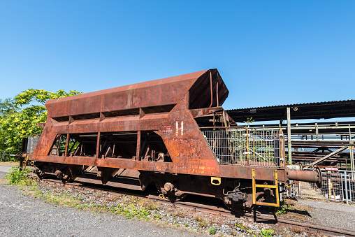 Hattingen, Germany - August 9, 2022: Ore rail cars for ore tansport in the disused ironworks Henrichshuette, industrial museum, Hattingen, North Rhine-Westphalia, Germany
