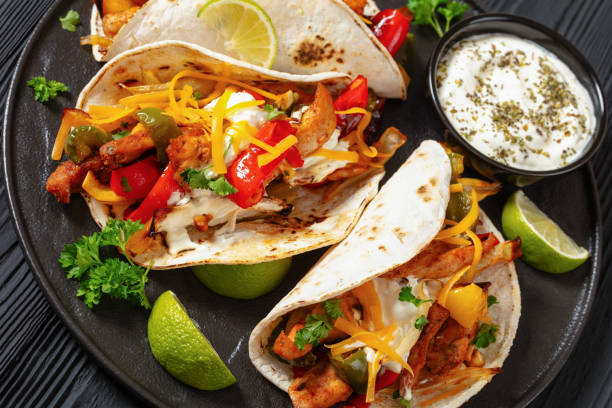 istock baked tex-mex chicken fajitas on a plate, top view 1999866879