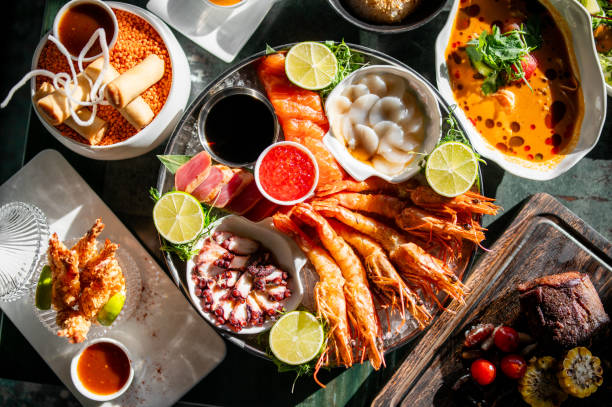 istock Set Seafood with salmon fish, tuna, shrimp on plate 1999871843