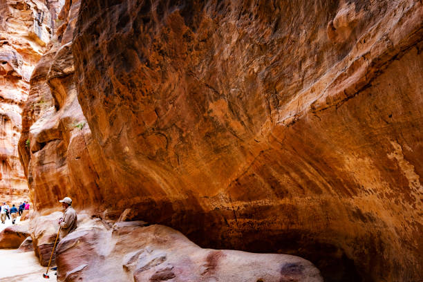 istock Group of tourists in path in Petra 1999881670