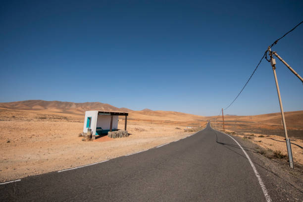 A typical white stop in Fuerteventura, Canary Islands, amidst the desert landscape. This iconic structure, blending with the arid surroundings, stands as a testament to the island's unique charm and architectural identity