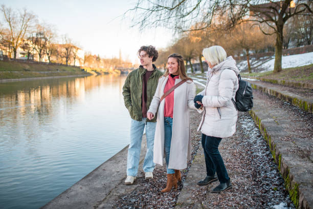 istock Family Enjoying a Winter Stroll by a River 1999915762