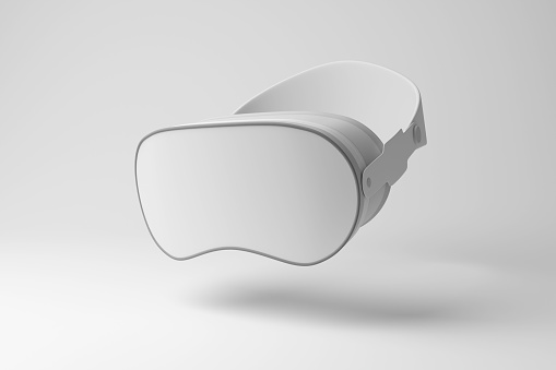 White VR goggles floating in mid air on white background in monochrome and minimalism. Illustration of the concept of virtual reality, augmented reality and metaverse