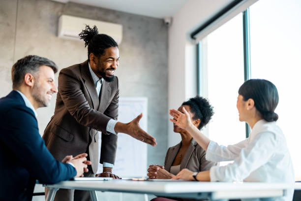 istock Professionals work together to complete a project, sharing ideas and solutions. 1999929153