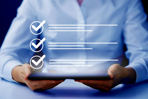 istock Survey form, check marks on checklist, document control, filling online form and answering questions, business project concept. 1999981247