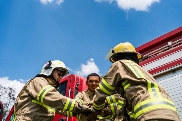 istock Firefighters with stacked hand outdoors 1999984425