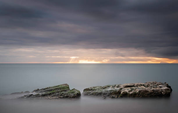 istock Beautiful sunset over the sea with long exposure. 1999995494