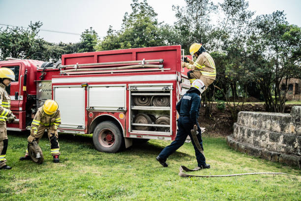 istock Firefighters preparing the fire hose on fire truck 2000004378