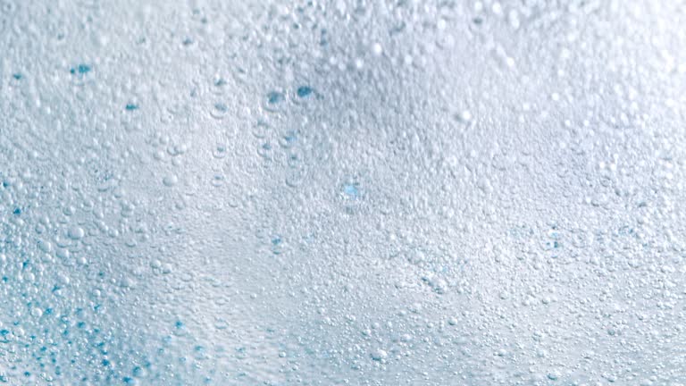 Super Slow Motion Shot of Bubbling Light Blue Background at 1000fps.