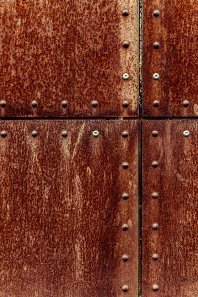 istock Rusted and riveted industrial metal surface 2000018093
