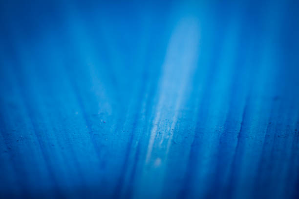 Extreme close up of blue acrylic paint texture showing brush strokes. Selective focus.