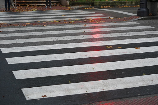 Zebra crossing or pedestrian crossing painted on the road in the city of Santander, Spain