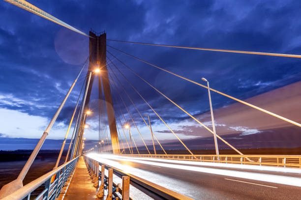 istock Cable-stayed bridge at sunset against a beautiful sky and in the rays of evening lighting. Moore. Russia. 2000054768