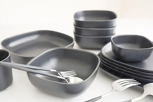 Set of black ceramic bowls and plates