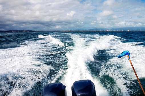 Boat sailing at full speed in direction of la tortuga island