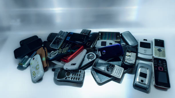 istock Old used cellphones pile as background 2000113932