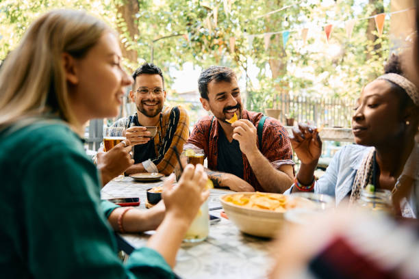 istock Happy man having fun while gathering with friends in a cafe. 2000115070
